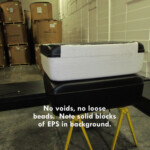 No voids, no loose beads. Note solid blocks of EPS in background.